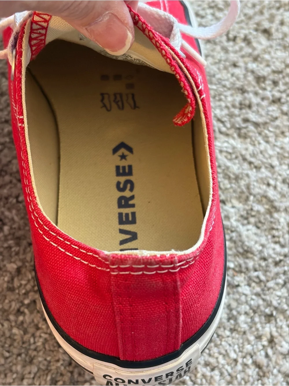 Converse red low-top sneakers with white laces